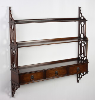A pair of Georgian style mahogany 3 tier wall shelves with pierced panels to the side, the base fitted 3 drawers with ring drop handles 93cm h x 95cm w x 19cm d 