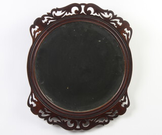 A Victorian circular bevelled plate wall mirror contained in a pierced mahogany frame 38cm diam. 