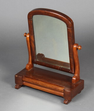 A Victorian arched plate dressing table mirror contained in a mahogany frame, the base fitted a drawer 58cm x 43cm x 18cm  