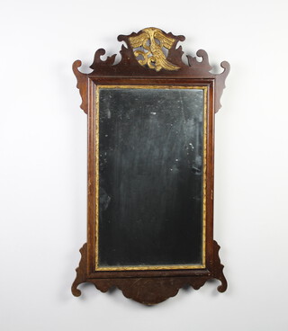 A Chippendale style rectangular plate wall mirror contained in a walnut frame surmounted by an eagle 67cm x 38cm 