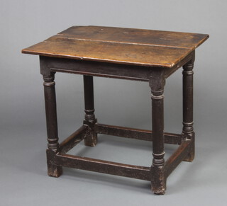 An 18th Century oak side table, the top formed from 2 planks raised on turned and block supports with box framed stretcher 66cm h x 74cm w x 55cm d 