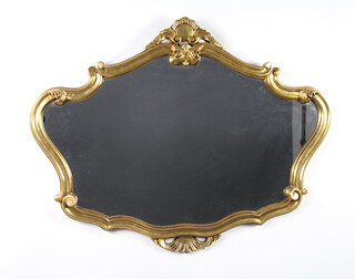 A shaped plate wall mirror contained in a decorative gilt frame 70cm h x 90cm w 