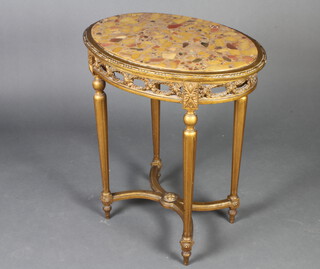 A Louis style pierced oval gilt wood occasional table with marble effect top, raised on turned and fluted supports with X framed stretcher 73cm x 64cm x 47cm 