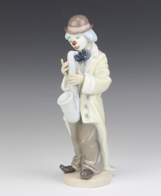 A Lladro figure of a clown playing a saxophone 5471 22cm 