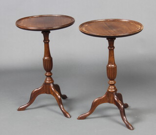 A pair of Georgian style circular mahogany wine tables, raised on a pillar and tripod base 54cm h x 35cm w 