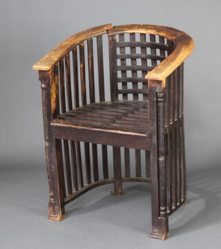 A 1920's Liberty style hardwood stick and tub back chair  