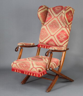 An Edwardian mahogany folding wing framed campaign chair 