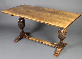 A 17th Century style rectangular elm refectory dining table raised on cup and cover supports with H framed stretcher 77cm x 152cm l x 81cm w  