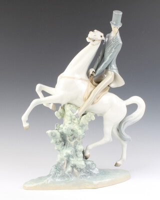 A Lladro figure of a gentleman on horseback 49cm 