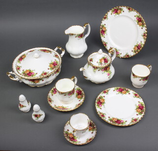 A Royal Albert Old Country Roses tea, coffee and dinner service comprising 6 dinner plates, 6 side plates, 6 small plates, 6 small saucers, 6 large saucers, meat plate, a cup and saucer, 6 small tea cups, 6 coffee cups, 6 tea cups, a gravy boat and stand, 2 tureens and covers, 1 rectangular platter, cake stand, teapot, coffee pot, milk jug, sugar bowl, cream jug, hexagonal box, square dish, rectangular dish, a jardiniere, a salt and pepper, miniature boot and hand bell
