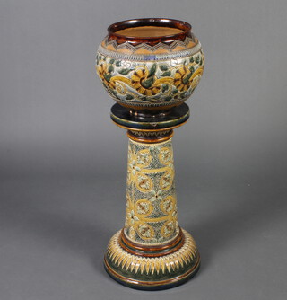 A Doulton Lambeth jardiniere stand decorated with stylised flowers 75cm together with a Doulton Lambeth jardiniere decorated with scrolling flowers 28cm 