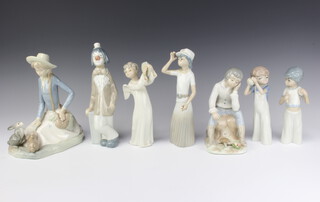 A Nao figure of an angel with a tambourine 20cm and 6 other Spanish figures