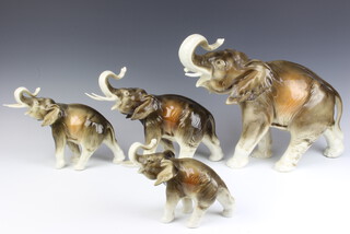 A herd of 4 Royal Dux elephants 33cm, 24cm, 20cm and 15cm 