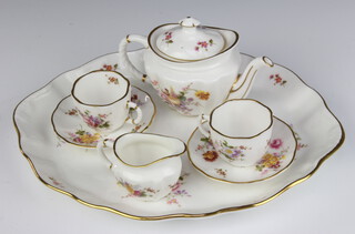 A Royal Crown Derby posies miniature tea set comprising teapot, milk jug, 2 tea cups, 2 saucers and a tray