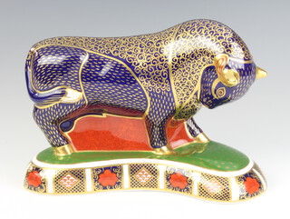 A Royal Crown Derby Imari pattern paperweight in the form of a bull with gold stopper 19cm 