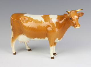 A Beswick Guernsey cow 1248A, gold brown and white gloss, 10.8cm 