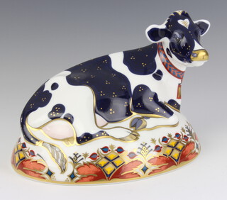 A Royal Crown Derby Imari pattern paperweight of Friesian Cow Buttercup with gold stopper 17cm 