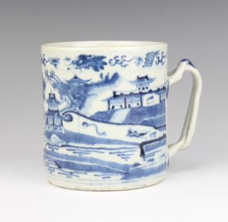 An 18th Century Chinese porcelain blue and white mug decorated with an extensive landscape scene with entwined handle 11cm 