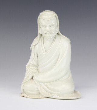A 19th Century blanc de chine figure of a seated dignitary 15cm 