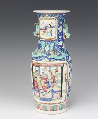 A 19th Century Chinese famille rose vase decorated with painted panels of flowers with pavilion in garden settings, having lion handles 25cm 