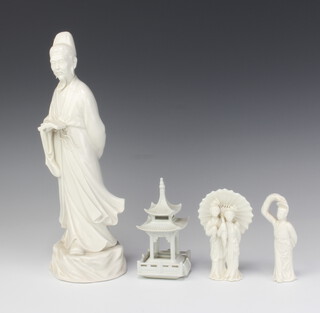 A 19th Century style Chinese blanc de chine figure of a scholar raised on a rocky base 29cm and 3 other blanc de chine figures 