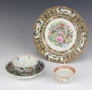 An 18th Century Chinese tea bowl and saucer decorated with flowers, a tea bowl decorated with insects and flowers and a late famille rose plate 