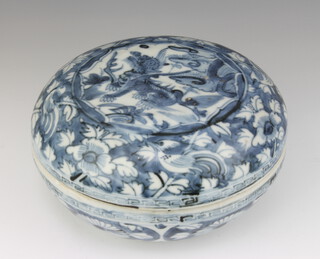 A 19th Century Chinese circular box and cover decorated with a dragon beneath clouds 20cm 