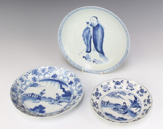 An 18th Century Chinese blue and white dish decorated with a lady sitting beneath bamboo 17cm, 2 other plates 