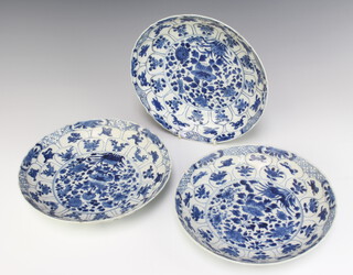 A set of 3 19th Century Chinese shallow dishes decorated with panels of flowers 22cm 