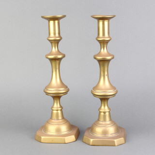 A pair of 19th Century brass candlesticks with ejectors 31cm h x 11cm w x 11cm d 