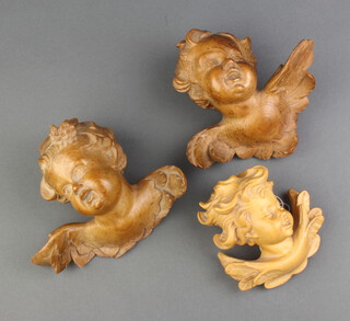 Two 18th Century style carved lime wood busts of cherubs 13cm x 14cm and 1 other 10cm x 6cm 