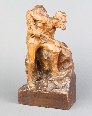 A carved wooden figure of a huntsman with gun, base marked Cortinas Fimpezzo 1925 25cm h  14cm w x 8cm d 