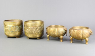 A pair of Chinese melon shaped gilt bronze censors with panel decoration raised on hoof supports 9cm x 13cm (1 ring handle missing) together with a pair of gilt metal Chinese style jardinieres on panel supports 12cm x 14cm 
