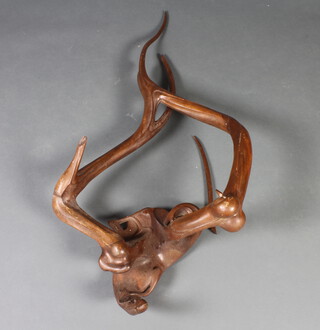 M W Pierce, a carved wooden free form sculpture 131cm x 35cm 