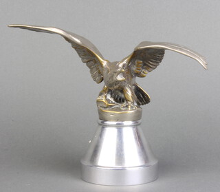 Louis Lejeune Ltd, a car mascot in the form of an eagle with outstretched wings, the base marked 21 Copyright AEL 10cm h x 17cm w, raised on a circular chrome base 