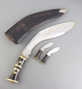 A Kukri with horn grip, 2 skinning knives and scabbard