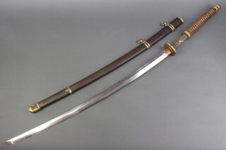 A Katana sword with bronze Tsuba, tang with 3 figure signature and 78cm blade with metal and gilt scabbard