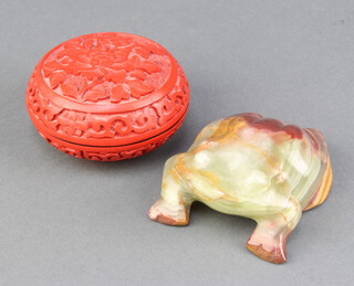 A Oriental carved hardstone figure of a toad 4cm x 8cm x 6cm and a cylindrical cinnabar lacquer jar and cover 4cm x 7cm  

