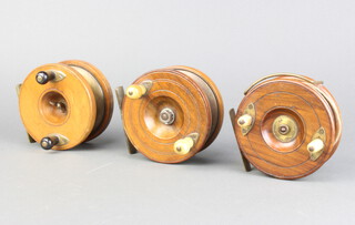Three 19th Century wooden and brass star back fishing reels, 1 marked Fields Fishing Tackle, both 10cm 