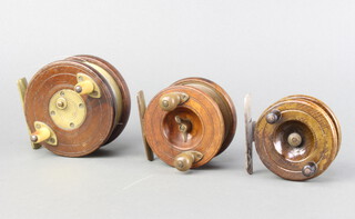 Three 19th Century brass and wooden centre pin fishing reels 10cm, 7cm and 6.5cm