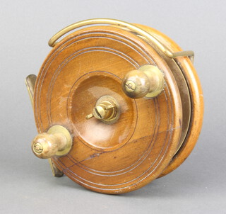 A Gamage 19th Century brass and mahogany centre pin fishing reel 12cm 