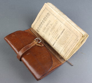 A Companion to Alfred Ronald's Fly Fishing Entomology, a leather fly fishing wallet containing vintage flies 