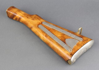 A Trench Art cribbage board formed from a rifle butt 32cm x 10cm x 3cm