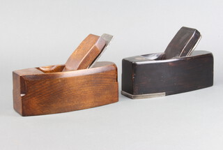 An ebonised and steel bottomed smoothing plane, the blade marked William Marples and Sons together with 1 other wooden smoothing plane marked W Marples and Sons 