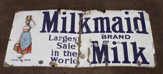 An enamelled advertising sign - Milkmaid Brand Milk largest sales in the world 56cm h x 122cm w 