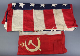 A pre 1948 American flag with 48 stars, hand stitched 150cm x 275cm, together with a Russian flag (2 small moth? holes) 90cm x 46cm 