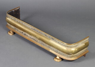 A Victorian pierced brass fender raised on panelled supports 23cm h x 108cm w  x 24cm d 