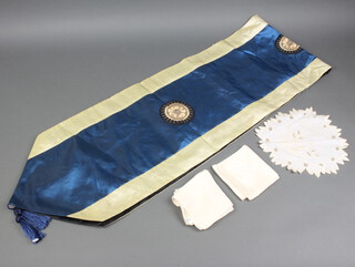A Chinese blue and white dart shaped table runner with 3 embroidered roundels to the centre 32cm w x 195cm l together with 2 white silk handkerchiefs (some staining) and a doily 