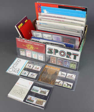 A collection of Elizabeth II mint presentation stamps and a collection of world mint presentation stamps 