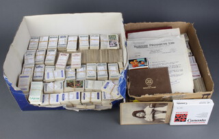 Two shallow boxes containing a collection of Wills, Players cigarette cards and a small collection of letters